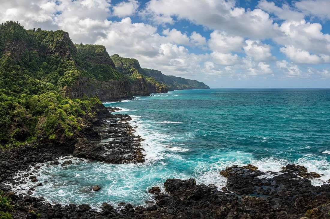 Black volcanic rock and turquoise water on a Hawaiian coast