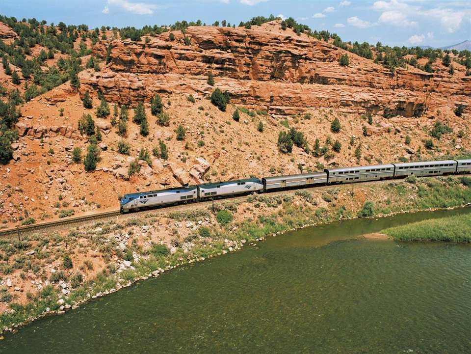 The California Zephyr beside the Colorado River and red rock