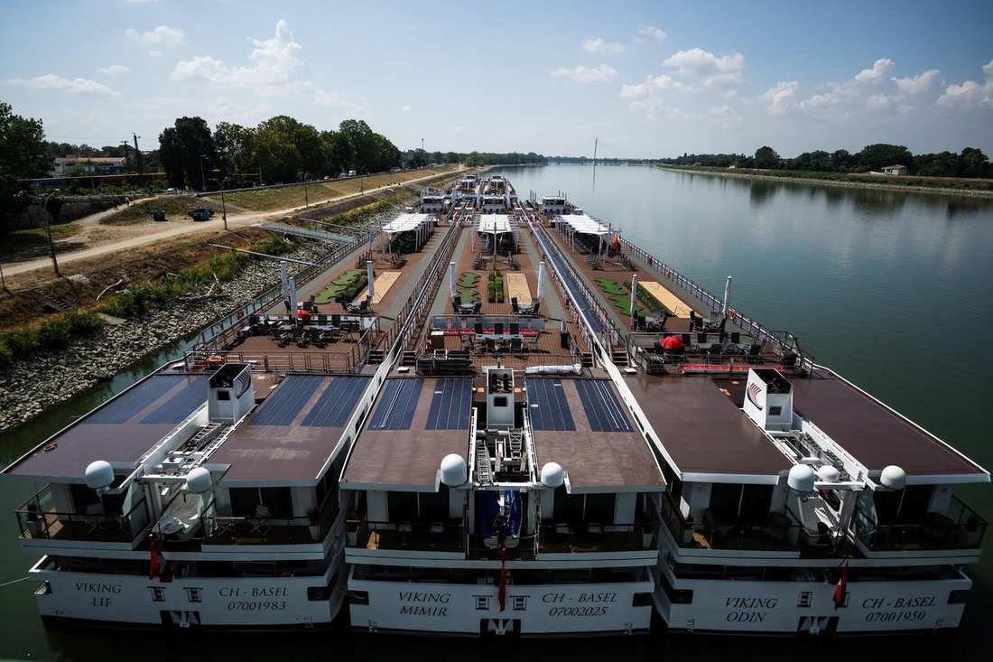 Viking river ships tied along a European river