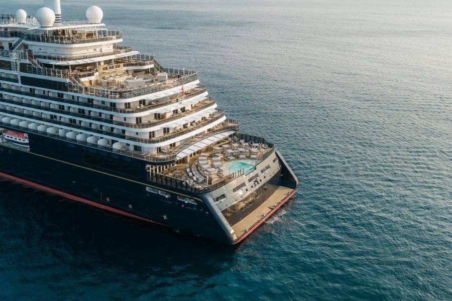 Explora III, a dark-hulled ship of about 900 guests, seen from above the stern
