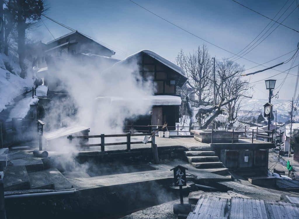Steam rising from a public hot-spring bath in snowy Nozawa Onsen
